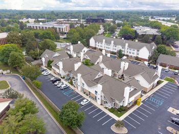 Arial view of building with a parking lot